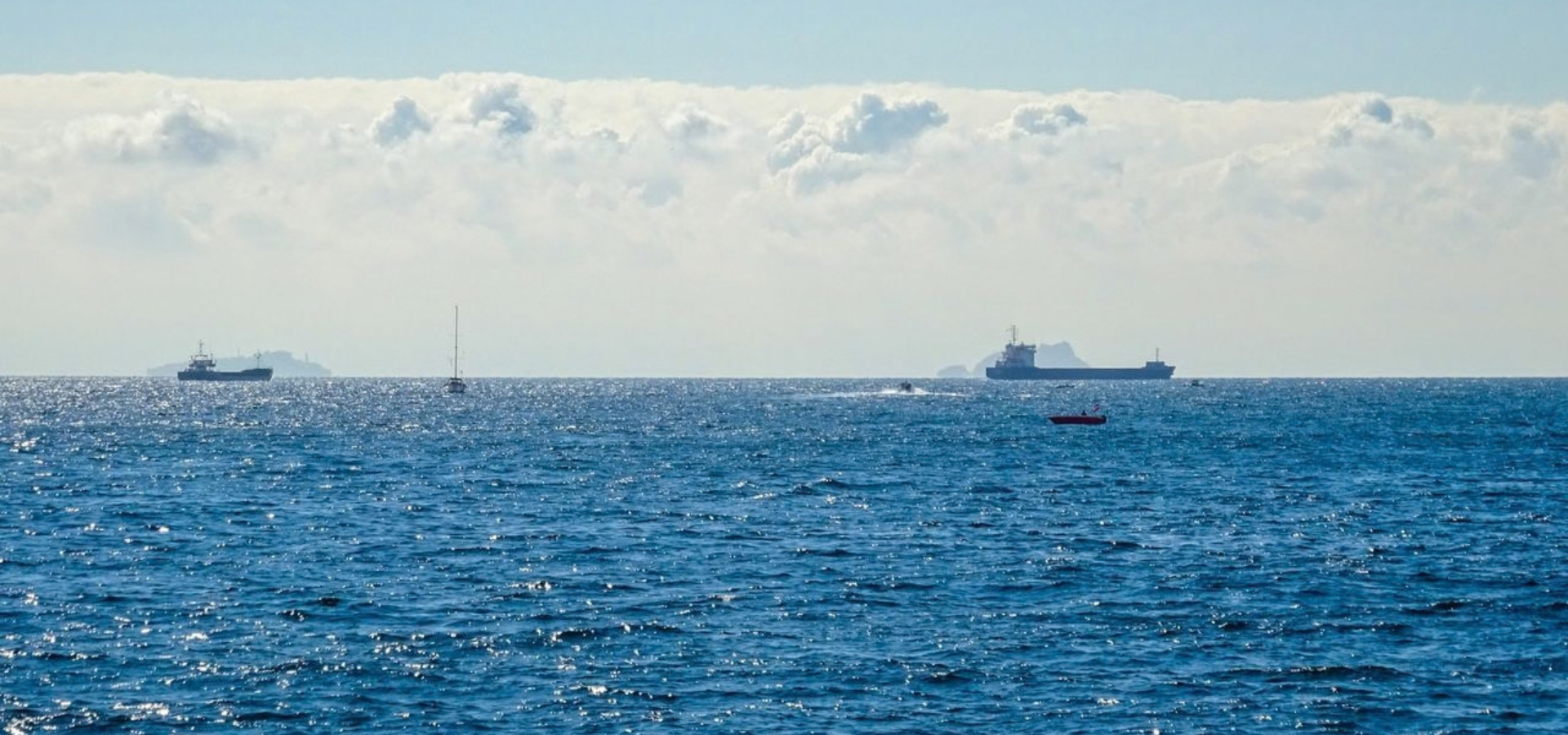 Commercial ship sailing across open water